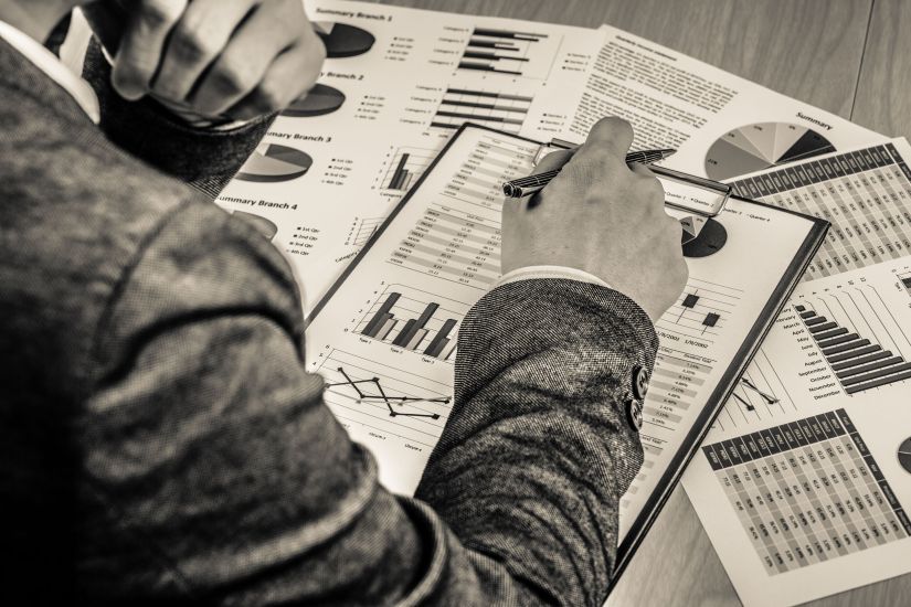 40196634 - man hand with pen and business report. accounting